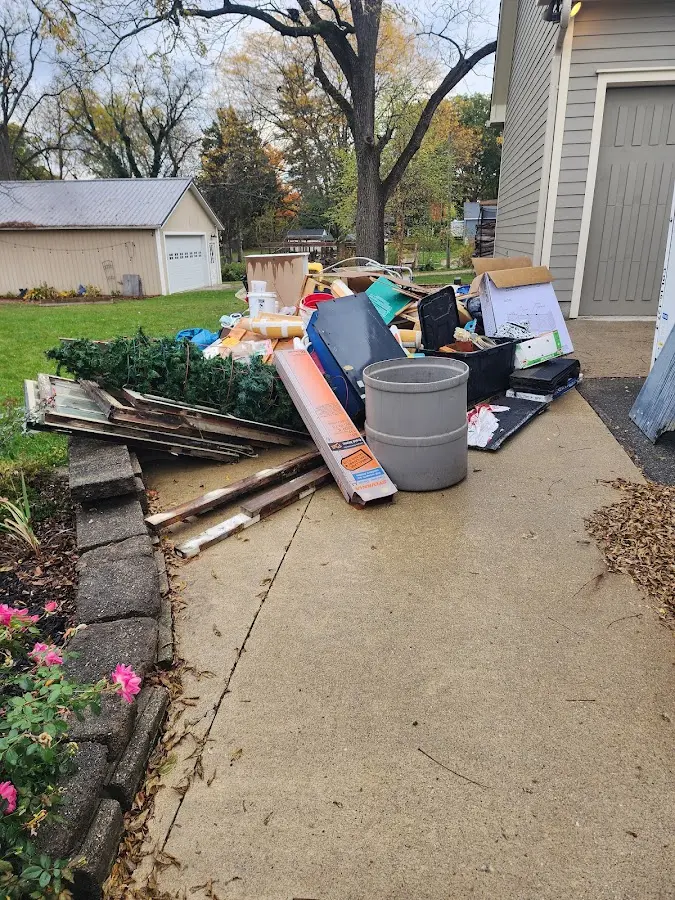 Dumpster being loaded with debris for Roofing Dumpster Rental in Combes